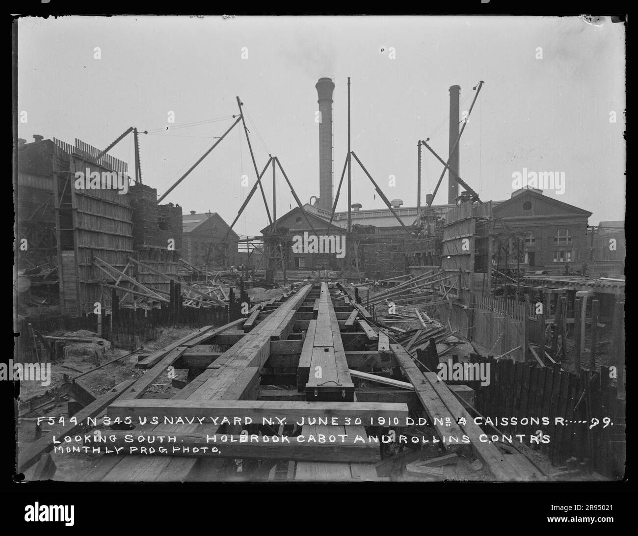 Dry Dock Number 4, Caissons R ..... 99, Looking South, Holbrook, Cabot and Rollins Contractors, Monthly Progress Photo. Glass Plate Negatives of the Construction and Repair of Buildings, Facilities, and Vessels at the New York Navy Yard. Stock Photo