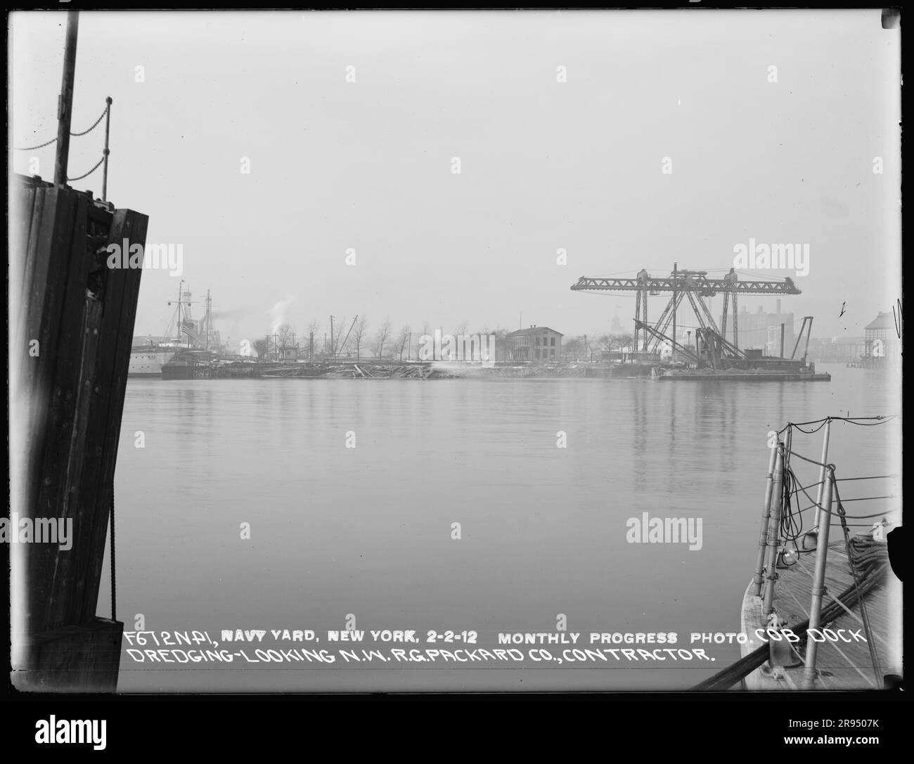 Monthly Progress Photo, Cob Dock Dredging, Looking Northwest, R. G. Packard Company, Contractor. Glass Plate Negatives of the Construction and Repair of Buildings, Facilities, and Vessels at the New York Navy Yard. Stock Photo