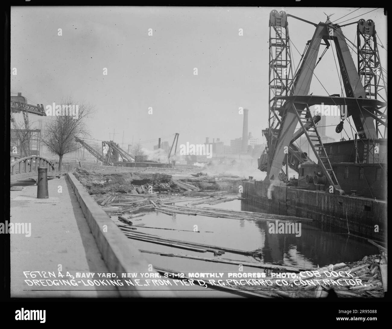 Monthly Progress Photo, Cob Dock Dredging, Looking Northeast from Pier D, R. G. Packard Company, Contractor. Glass Plate Negatives of the Construction and Repair of Buildings, Facilities, and Vessels at the New York Navy Yard. Stock Photo