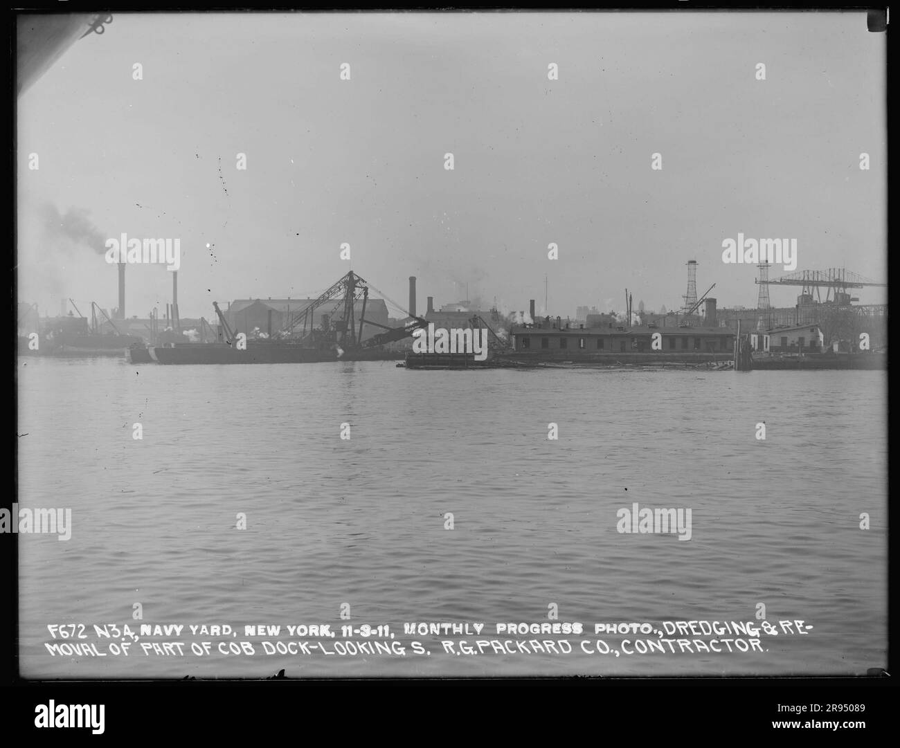 Monthly Progress Photo, Dredging and Removal of Part of Cob Dock, Looking South, R. G. Packard Company, Contractor. Glass Plate Negatives of the Construction and Repair of Buildings, Facilities, and Vessels at the New York Navy Yard. Stock Photo