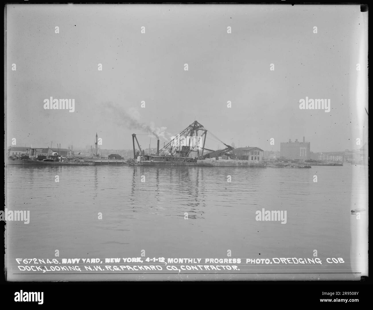 Monthly Progress Photo, Dredging Cob Dock, Looking Northwest, R. G. Packard Company, Contractor. Glass Plate Negatives of the Construction and Repair of Buildings, Facilities, and Vessels at the New York Navy Yard. Stock Photo