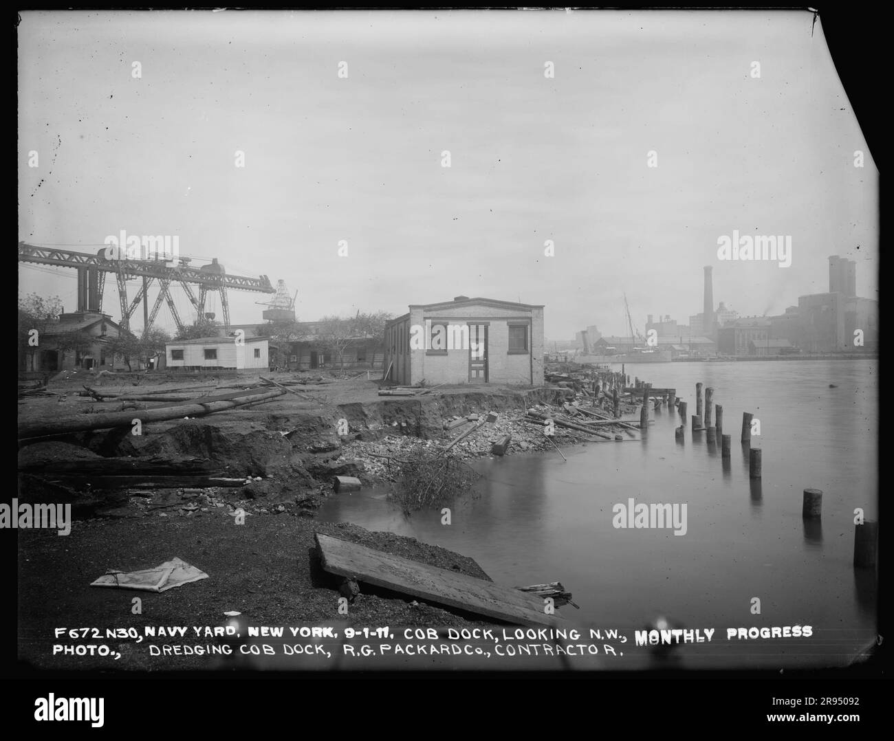 Cob Dock, Looking Northwest, Monthly Progress Photo, Dredging Cob Dock, R. G. Packard Company, Contractor. Glass Plate Negatives of the Construction and Repair of Buildings, Facilities, and Vessels at the New York Navy Yard. Stock Photo