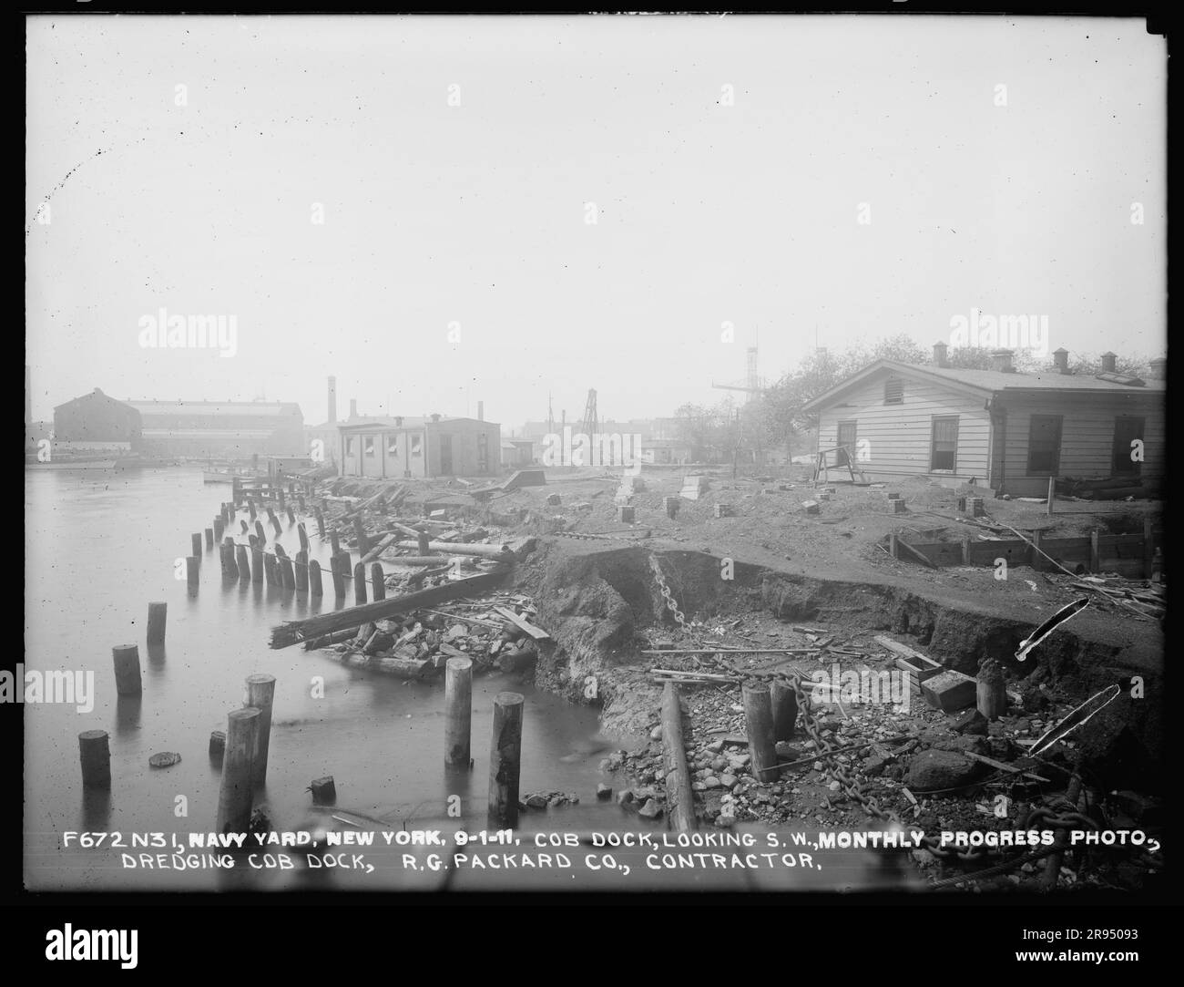 Cob Dock, Looking Southwest, Monthly Progress Photo, Dredging Cob Dock, R. G. Packard Company, Contractor. Glass Plate Negatives of the Construction and Repair of Buildings, Facilities, and Vessels at the New York Navy Yard. Stock Photo