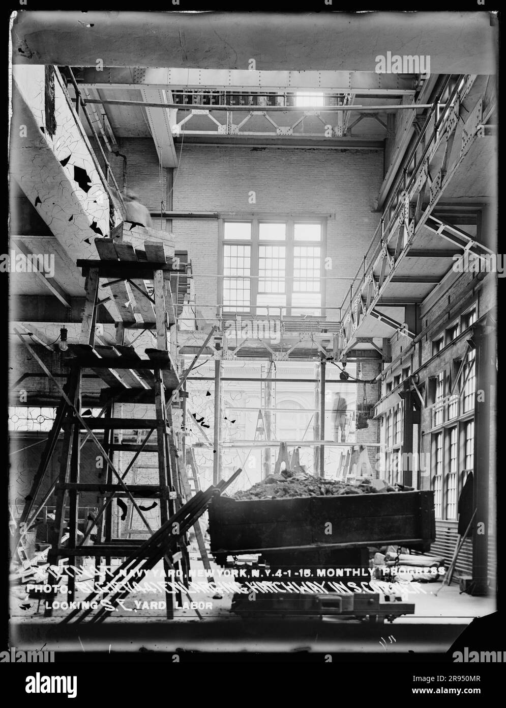 Monthly Progress Photo, Building 127 (44) Enlarging Hatchway in South Corner, Looking Southeast, Yard Labor. Glass Plate Negatives of the Construction and Repair of Buildings, Facilities, and Vessels at the New York Navy Yard. Stock Photo