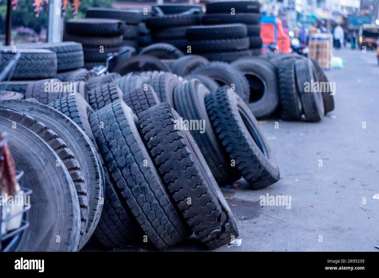 Used Tyres piled up and dumped in the roadside. Tires disposal Stock
