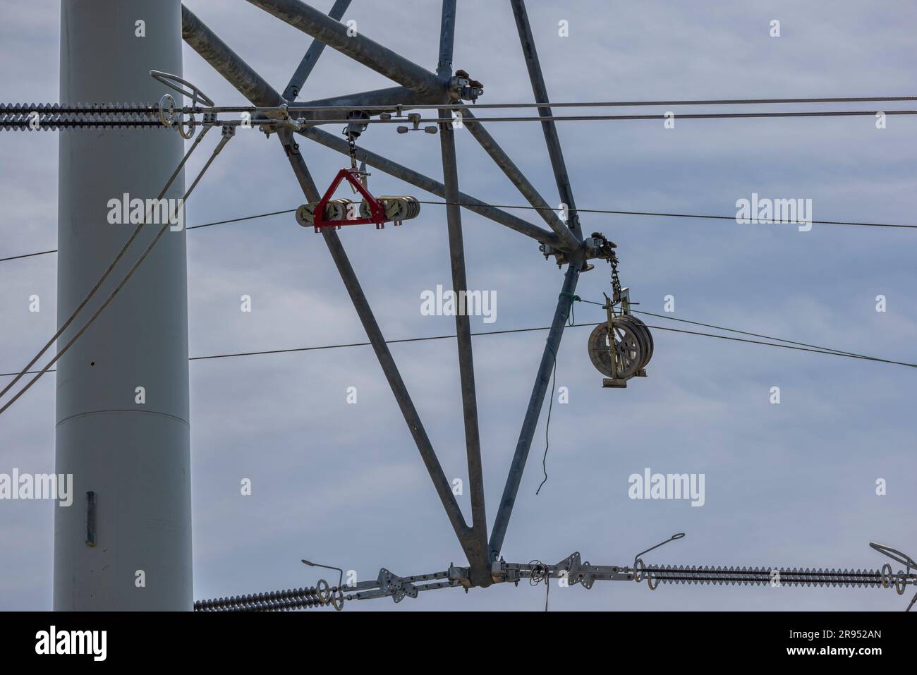 The process of pulling the cables through the diamond insulater sets