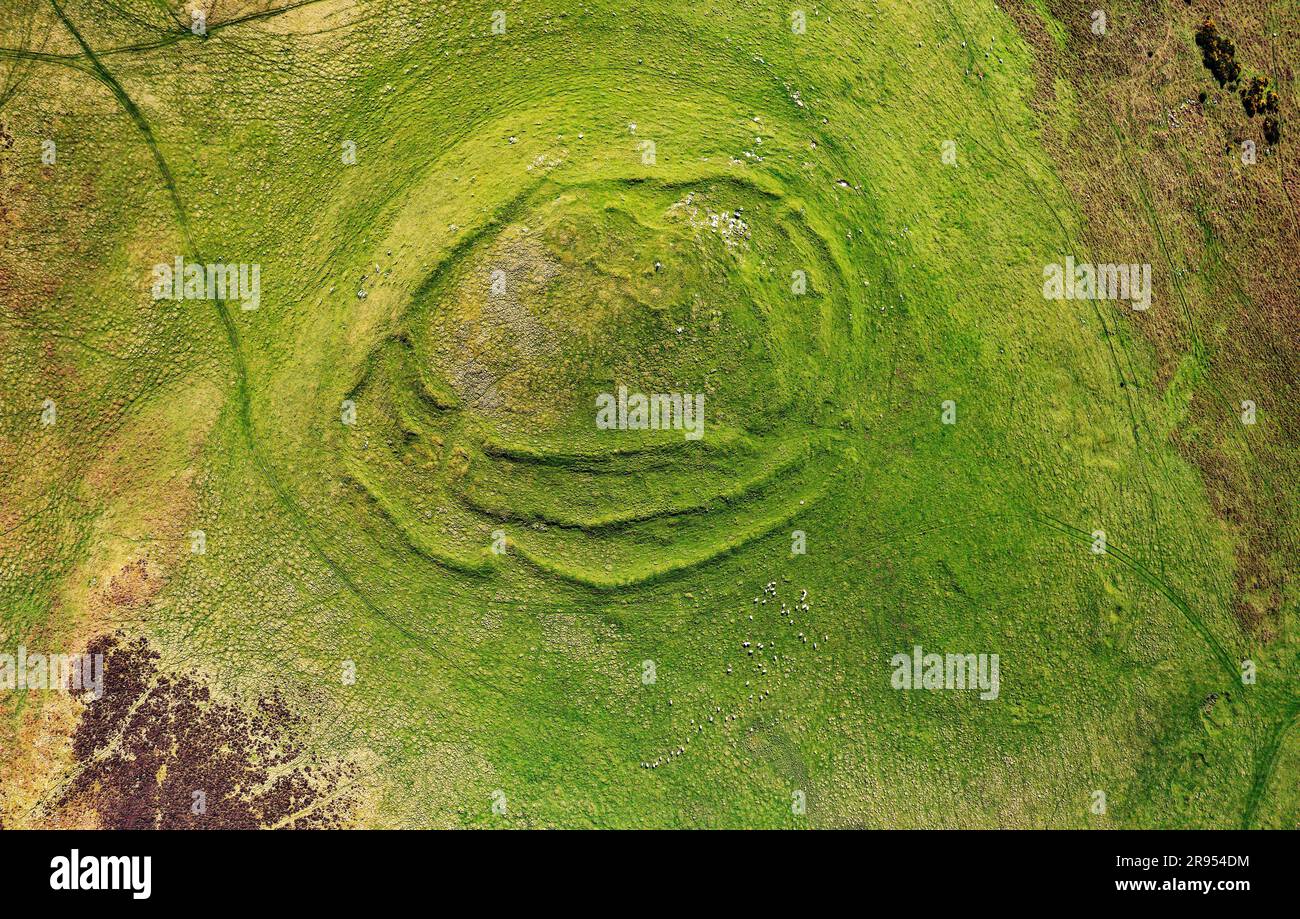 Cockburn Law late prehistoric hill fort near Duns in the borders region, Scotland. Aerial showing 3 earth and stone ramparts and 2 staggered entrances Stock Photo