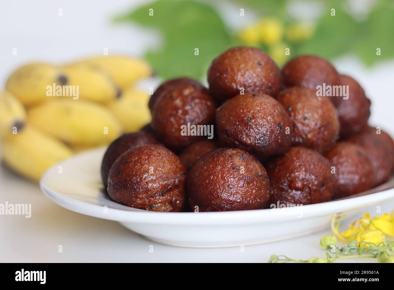 Unniyappam. Sweet rice fritters made with a batter of rice, banana, jaggery, ghee fried coconut