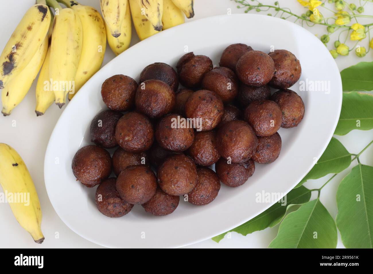 Unniyappam. Sweet rice fritters made with a batter of rice, banana, jaggery, ghee fried coconut