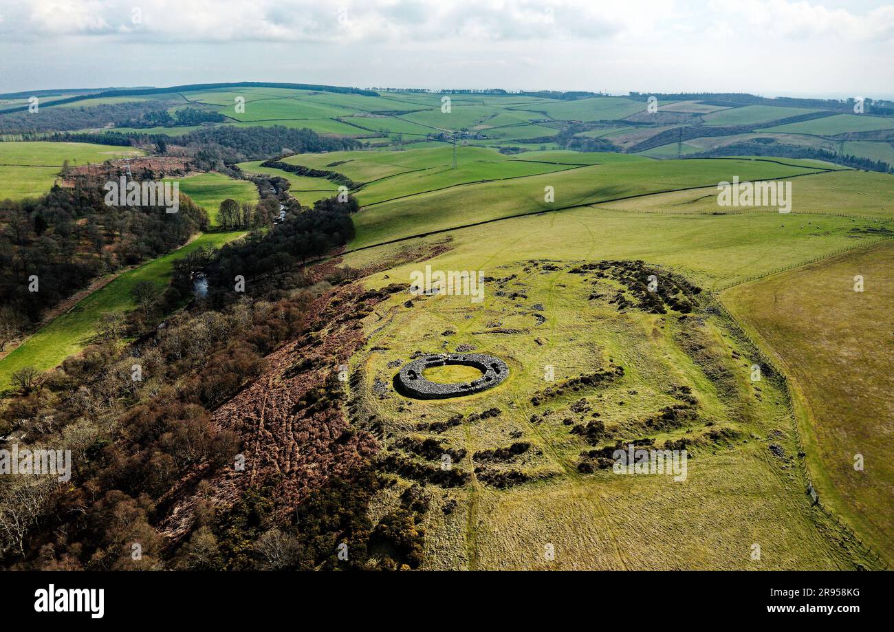 Edins Hall Hillfort and Broch above Whiteadder Water. Scotland. Circular stone footings of 2nd C broch within earlier Iron Age hillfort. Aerial from E Stock Photo