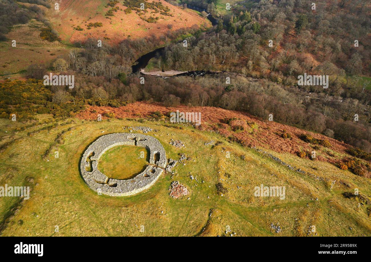 Edins Hall Broch above Whiteadder Water. Borders region, Scotland. Showing stone footings, intramural chambers and entrance of 2nd C broch. Aerial Stock Photo