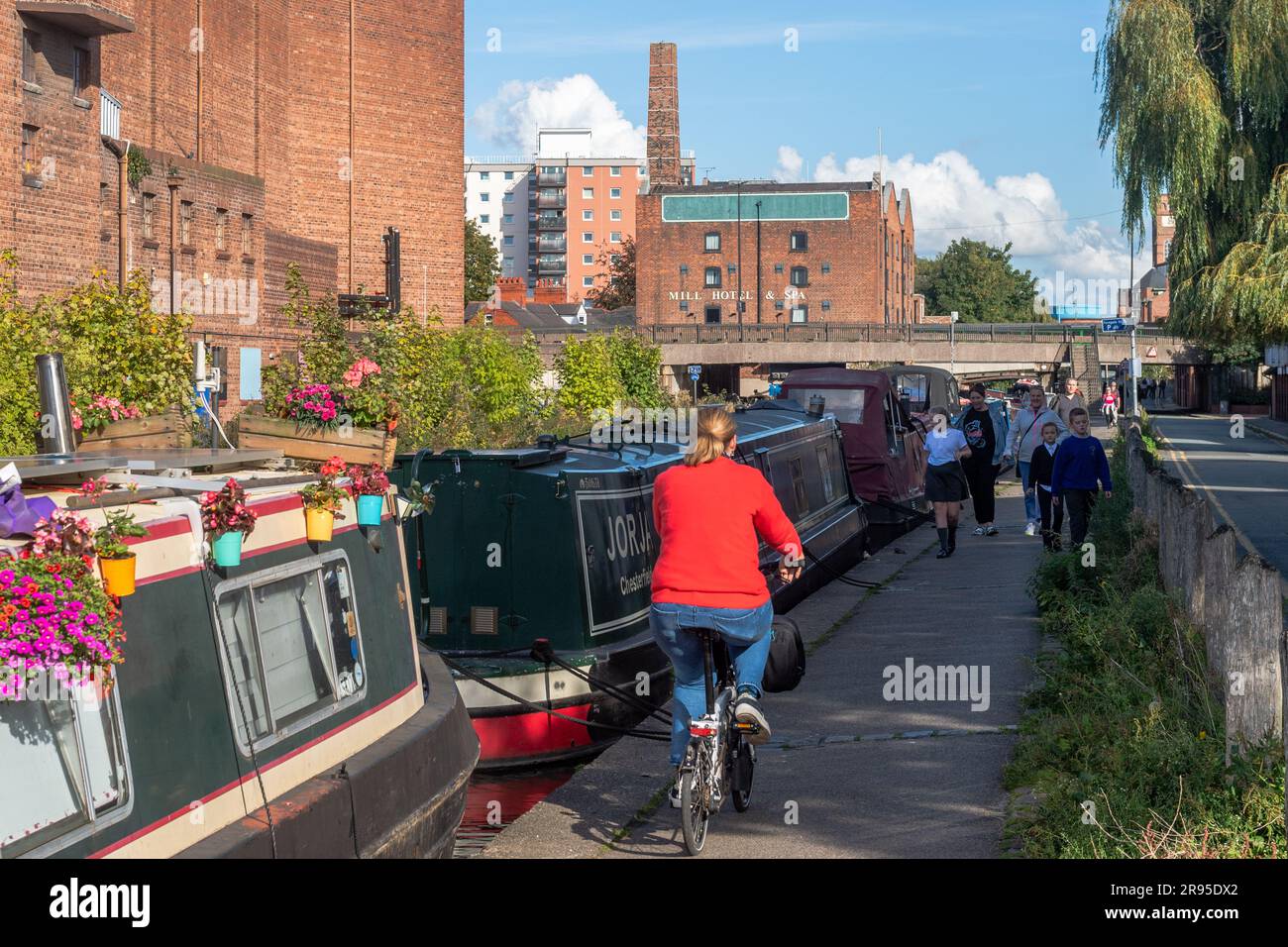 People on the Shropshire Union Canal towpath, Chester, Cheshire, UK. Stock Photo