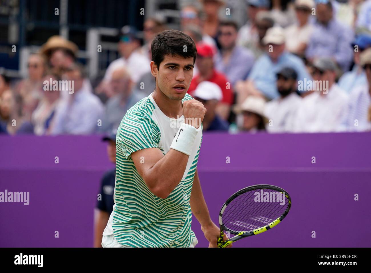 Carlos Alcaraz, of Spain, reacts after scoring a point against Sebastian Korda, of the US, during their mens singles semifinal match at the Queens Club tennis tournament in London, Saturday, June 24,