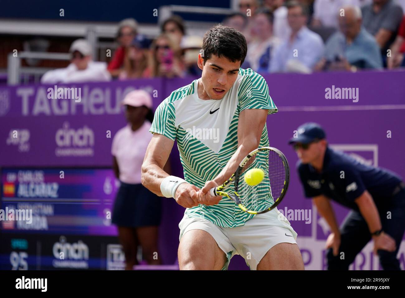Carlos Alcaraz, of Spain, returns with a backhand to Sebastian Korda, of the US, during their mens singles semifinal match at the Queens Club tennis tournament in London, Saturday, June 24, 2023.