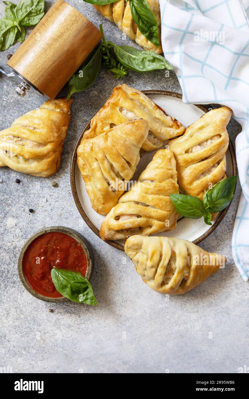 Festive Russian Kurnik sliced pie stuffed with chicken, potatoes and onions  close up on a slate board on the table. vertical top view above Stock Photo  - Alamy