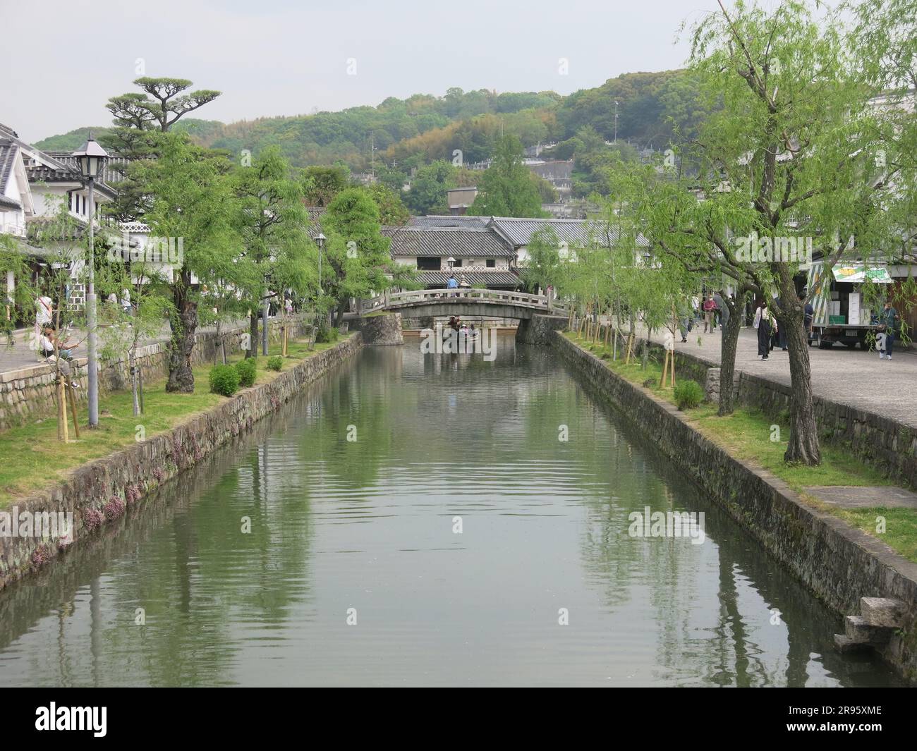 Kurashiki: one of the most picturesque towns in Japan with its white houses in the old merchant quarter and tree-lined canal with stone bridges. Stock Photo