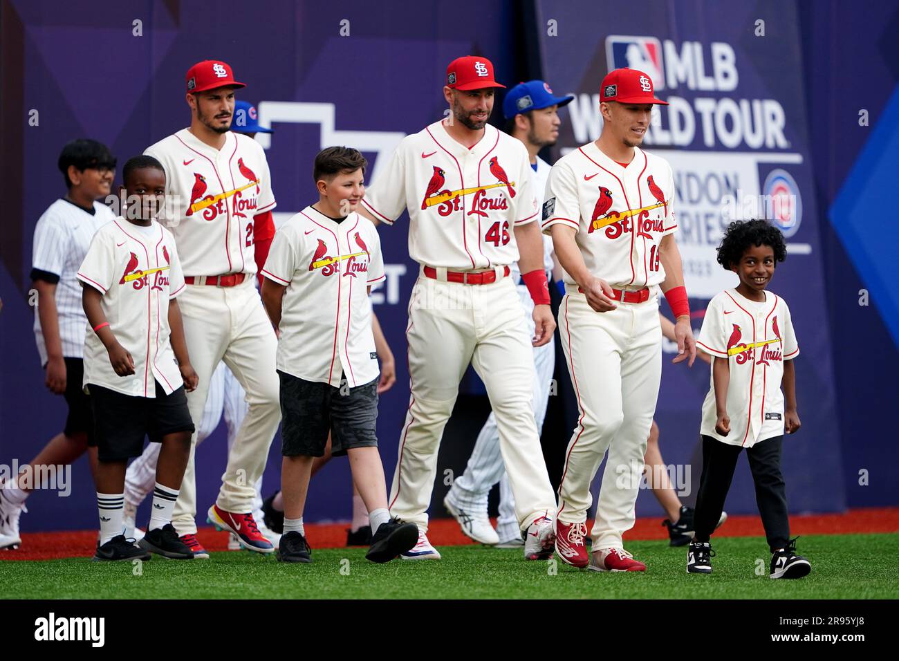 St. Louis Cardinals’ Tommy Edman (right) leads his side out with mascots ahead of the MLB London Series match at the London Stadium, London. Picture date: Saturday June 24, 2023. Stock Photo