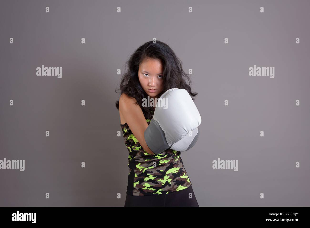asian ethnicity sportswoman with boxing gloves Stock Photo