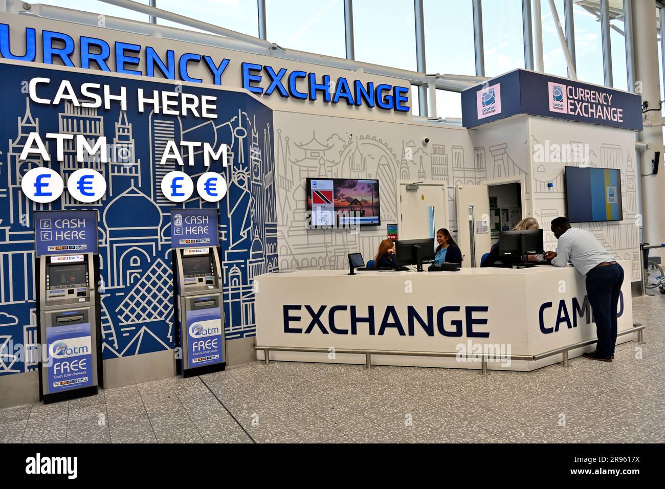 Currency exchange and cash for travel in airport arrivals / departure area Stock Photo