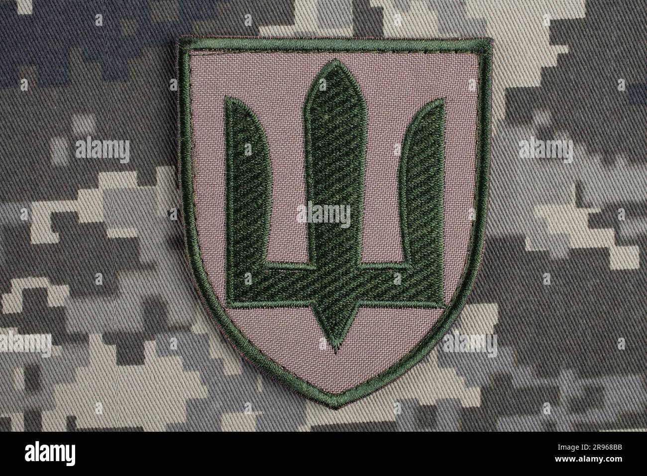 KYIV, UKRAINE - October 5, 2022. Russian invasion in Ukraine 2022. Ukraine Army uniform shoulder sleeve insignia badge on camouflaged uniform backgrou Stock Photo