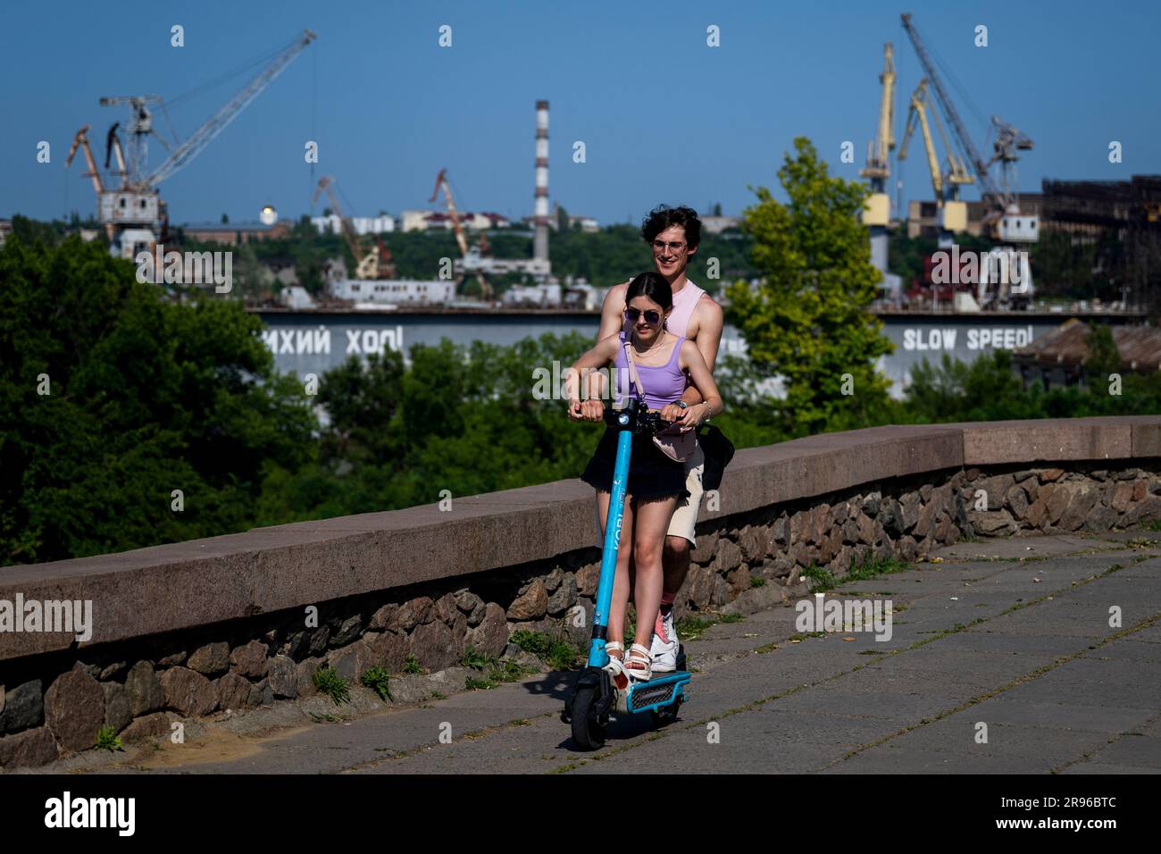 Mykolajiv, Ukraine. 24th June, 2023. Couple is riding scooter in Mykolaiv, Ukraine, June 24, 2023. Credit: Ondrej Deml/CTK Photo/Alamy Live News Stock Photo