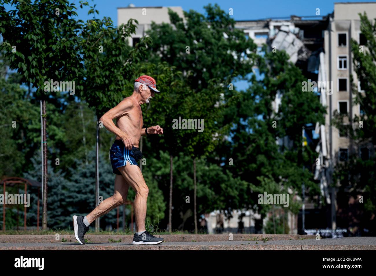 Mykolajiv, Ukraine. 24th June, 2023. Man is running at the street front of destroyed building in Mykolaiv, Ukraine, June 24, 2023. Credit: Ondrej Deml/CTK Photo/Alamy Live News Stock Photo