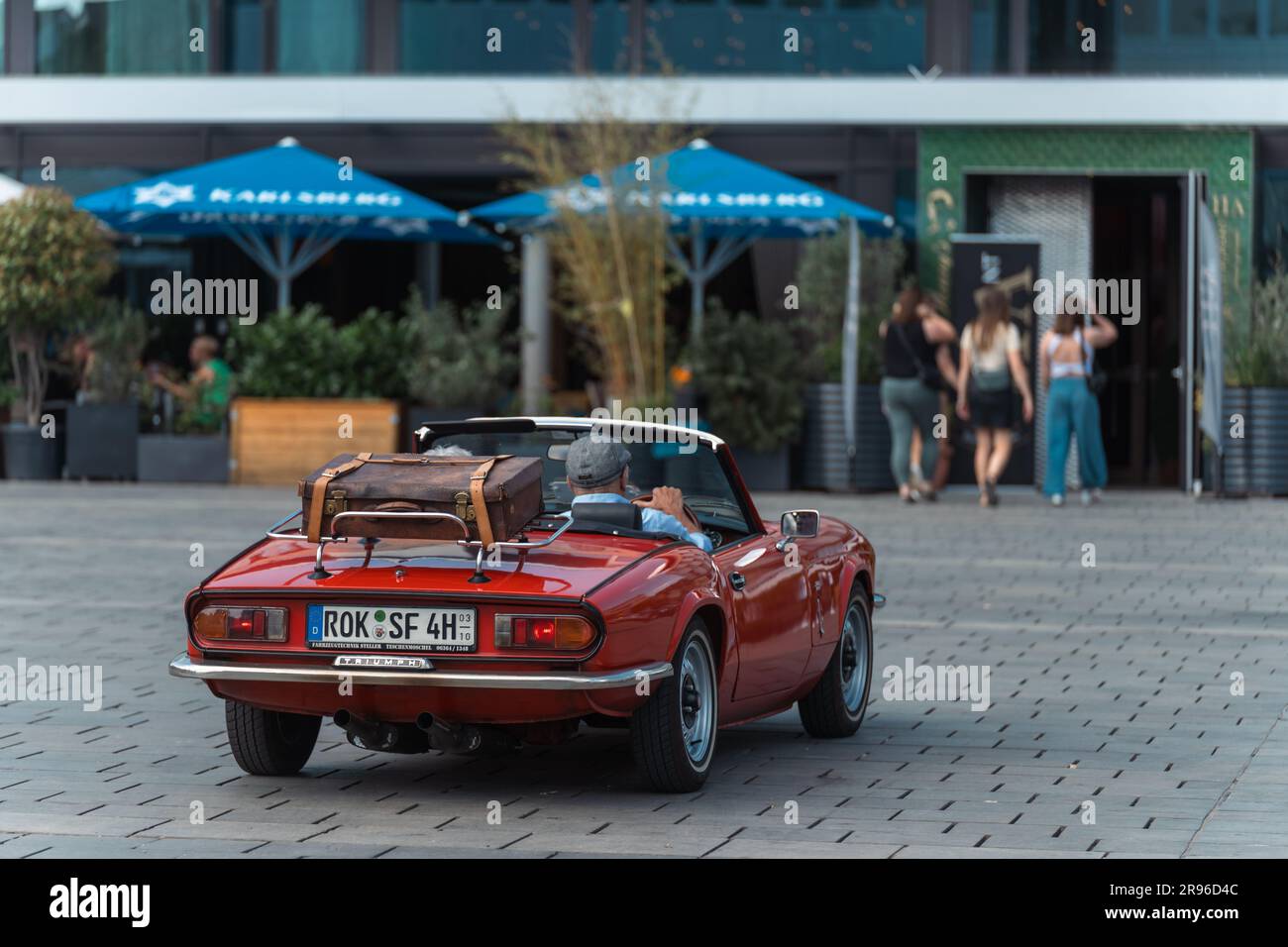 Kaiserslautern, Germany. 24th June, 2023. 1978 Triumph Spitfire 1500 arriving at Stiftsplatz (Square) after finished rallye. The 15th Kaiserslautern Classics combines a vintage car show with the former ADAC Trifels Historic rallye (now under the new 'ADAC Trifels Oldtimerwanderung' name) and a Vespa meeting. The event starts on Saturday 8:30 AM and continues at various public locations downtown through the day, accompanied by live music bands. Credit: Gustav Zygmund/Alamy News Stock Photo