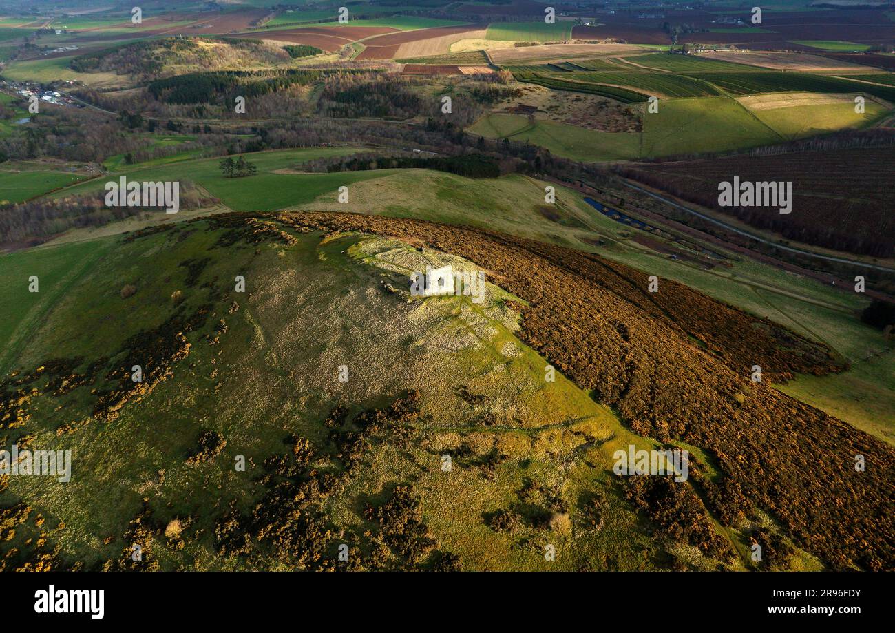 Dunnideer prehistoric hillfort c250 BC showing concentric ramparts. and ruined medieval Dunnideer Castle tower house. Near Insch, Grampian, Scotland Stock Photo