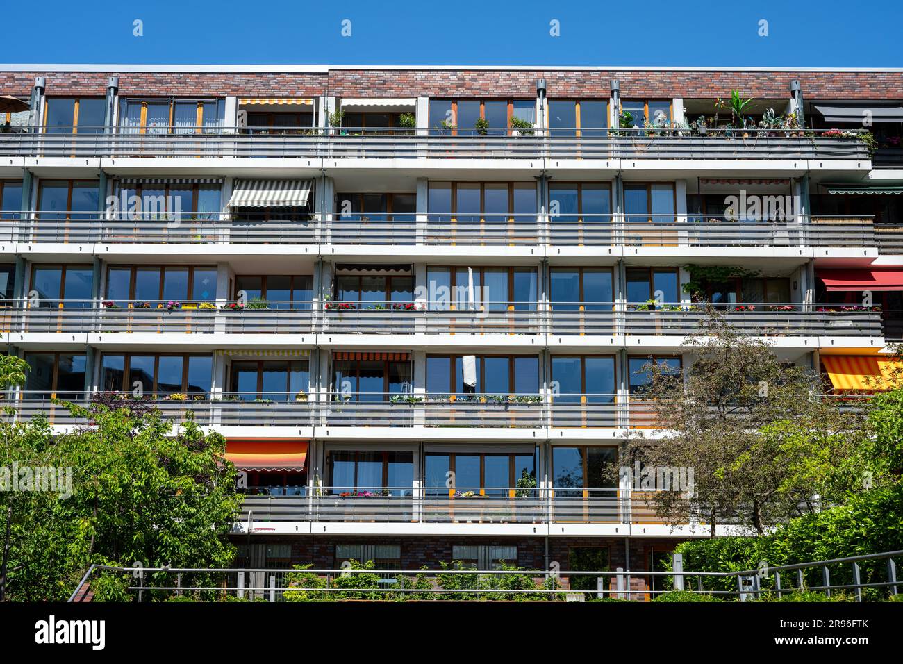 Facade of a modern apartment building with many balconies seen in ...