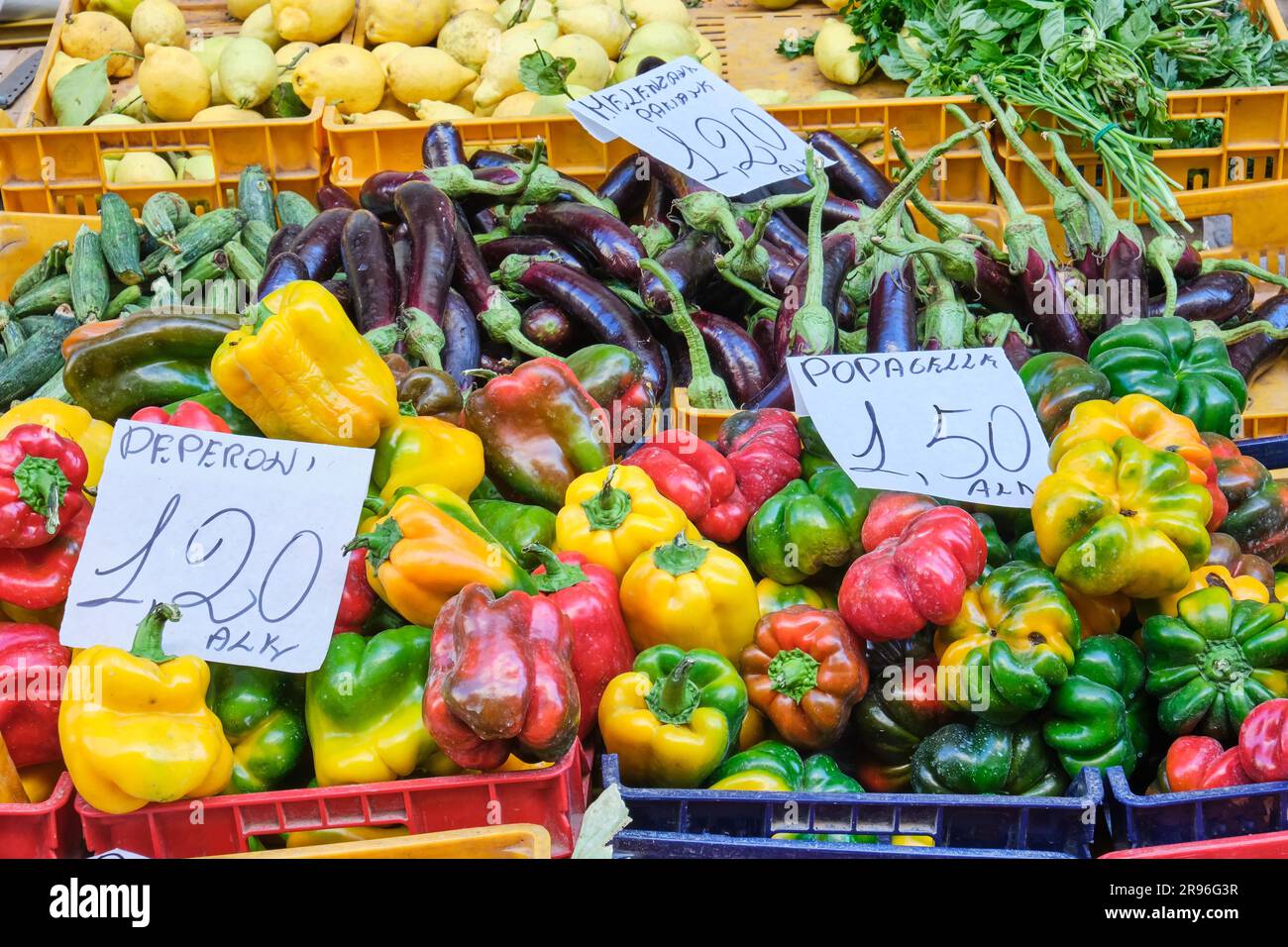 Peppers and aubergines for sale at a market Stock Photo - Alamy