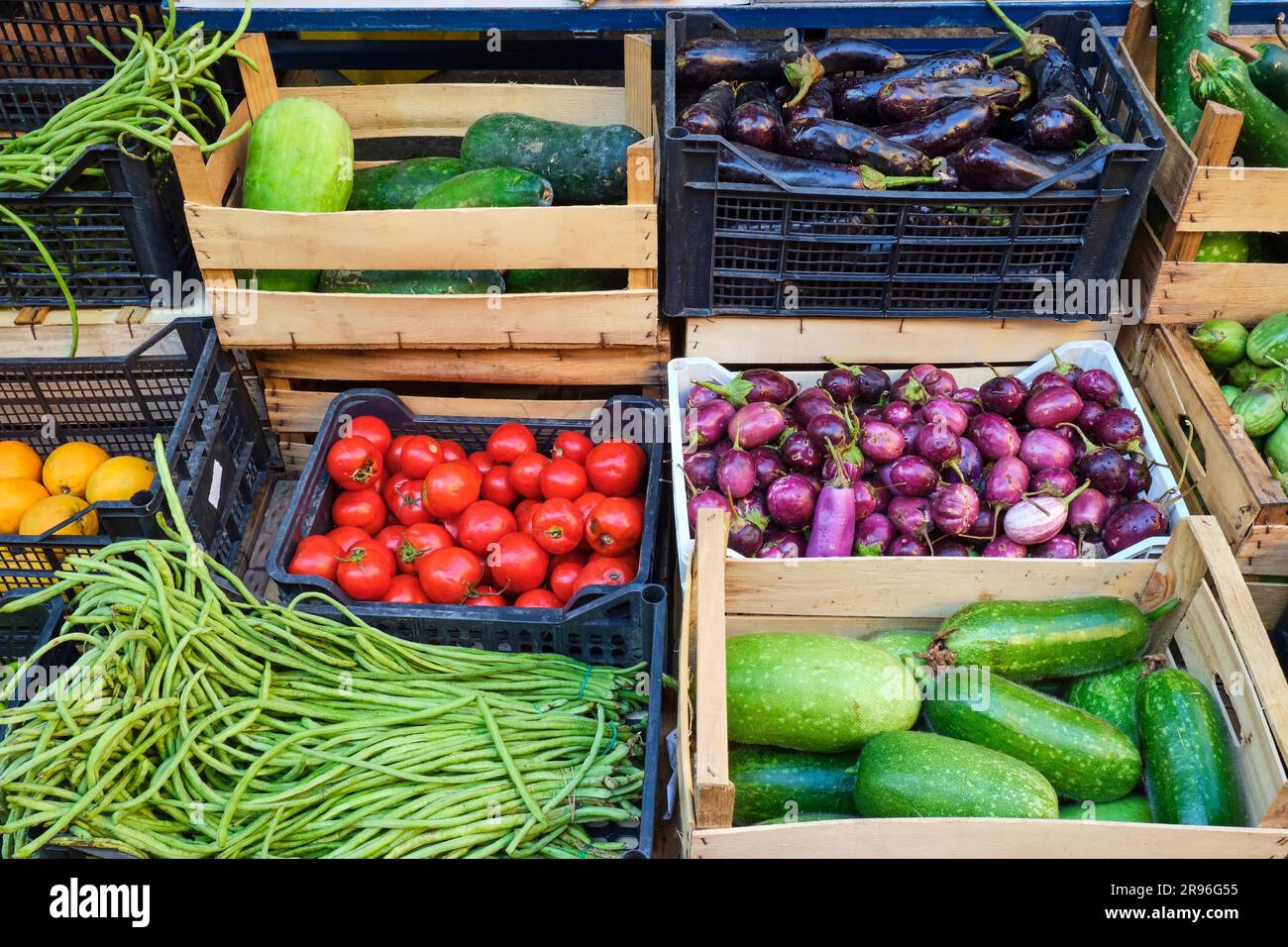 Fresh vegetables in wooden crates for sale at a market Stock Photo