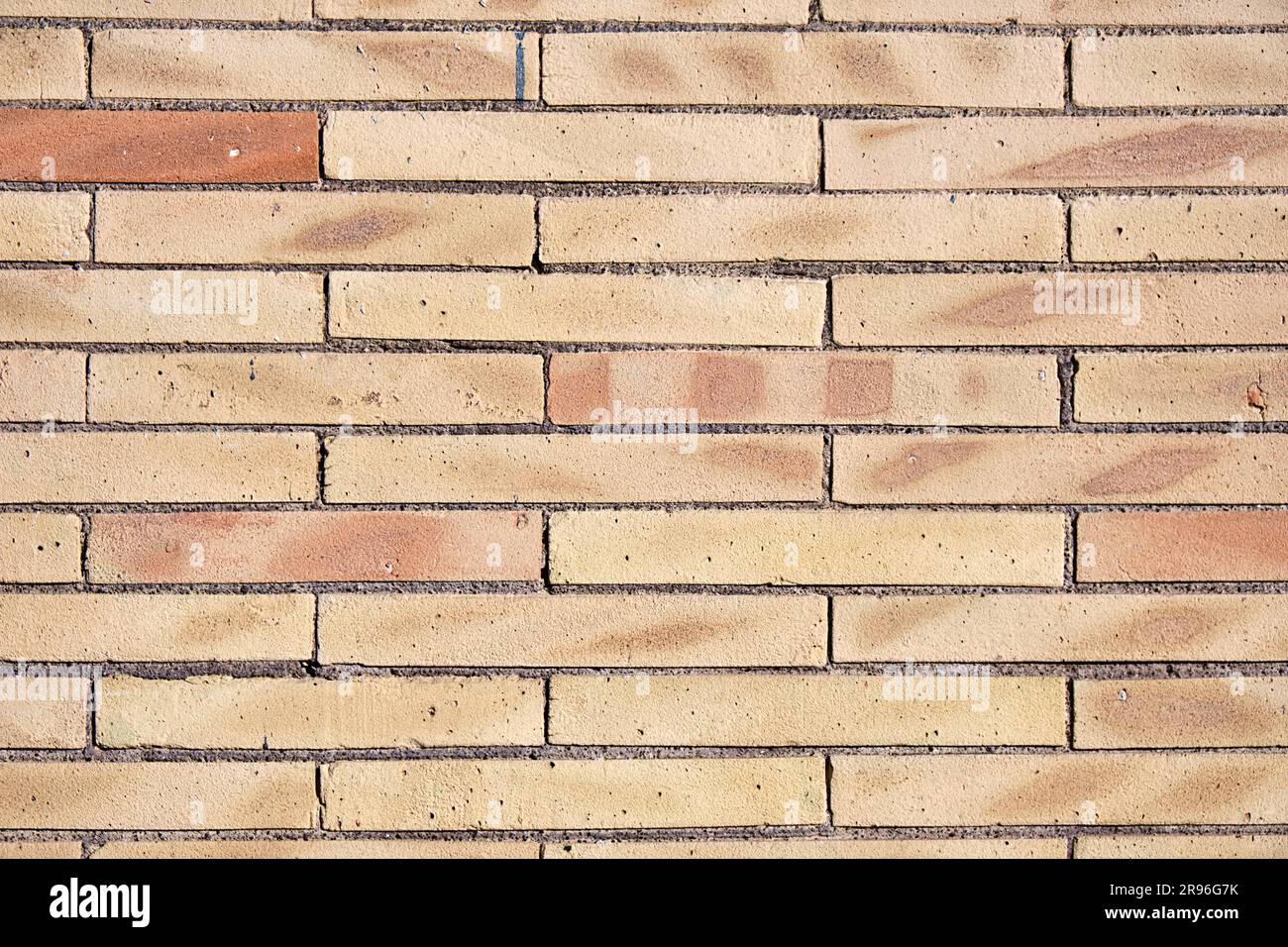 Background from a wall of beige clinker bricks Stock Photo
