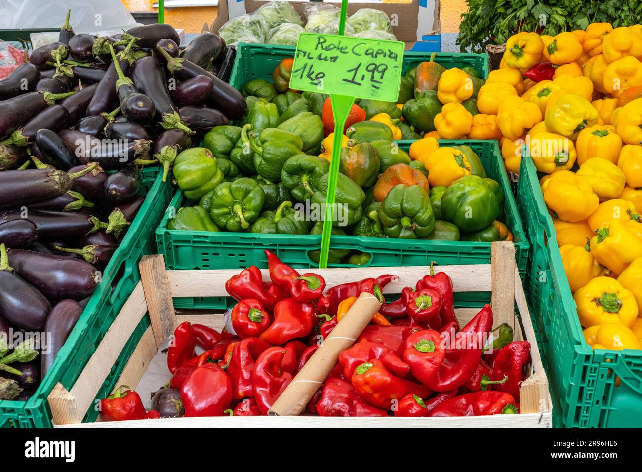 Colourful peppers and aubergines for sale at a market Stock Photo - Alamy