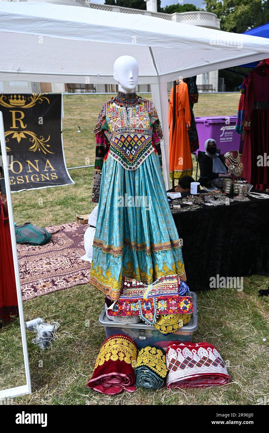 London, UK. 24th June, 2023. Every dress is unique by RONA Designs stall at the Refugee Week 2023 for the 25th, focused on Afghanistan culture, Afghans musicians, Persian musicians performance, delicious foods, Afghanistan traditional dress at Gunnersbury Park. Credit: See Li/Picture Capital/Alamy Live News Stock Photo