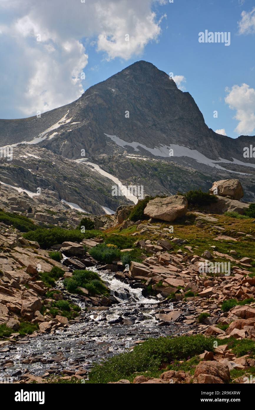 picturesque  waterfall and mt. toll along the hiking trail to blue lake, in the indian peaks wilderness area,  near nederland, colorado Stock Photo