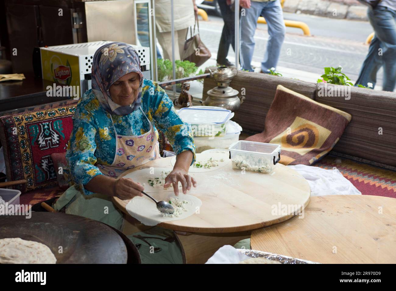 Woman baking Turkish speciality, in restaurant, Istanbul, bake, Turkey Stock Photo