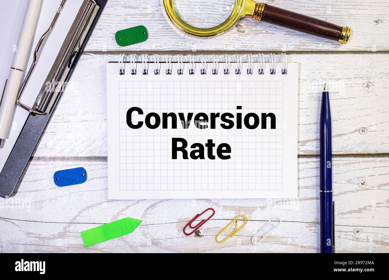 There is a notebook with the word Conversion Rate. It is eye-catching image Stock Photo