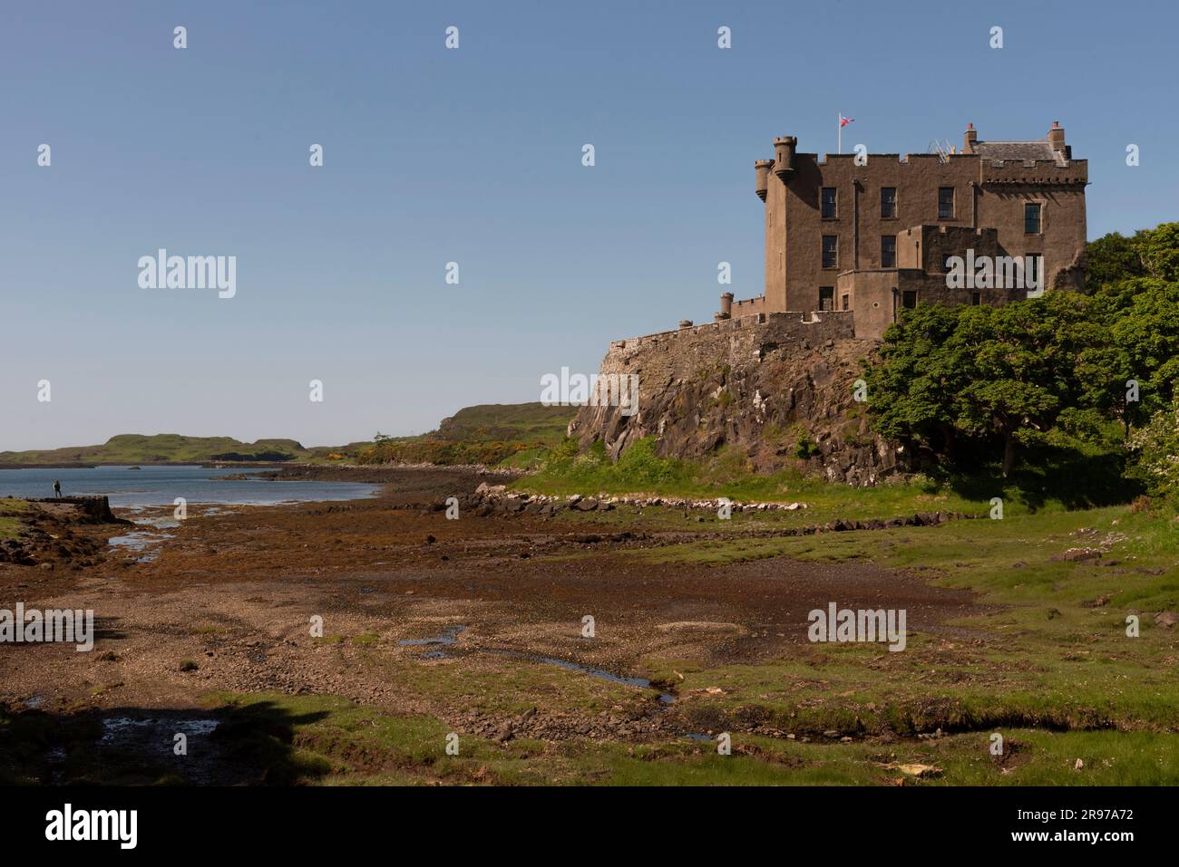 Dunvegan, Isle of Skye, Scotland, UK.  June 6 2023.  Dunvegan Castle viewed at low tide ,famous home of the Clan Macleod for 800 years Stock Photo