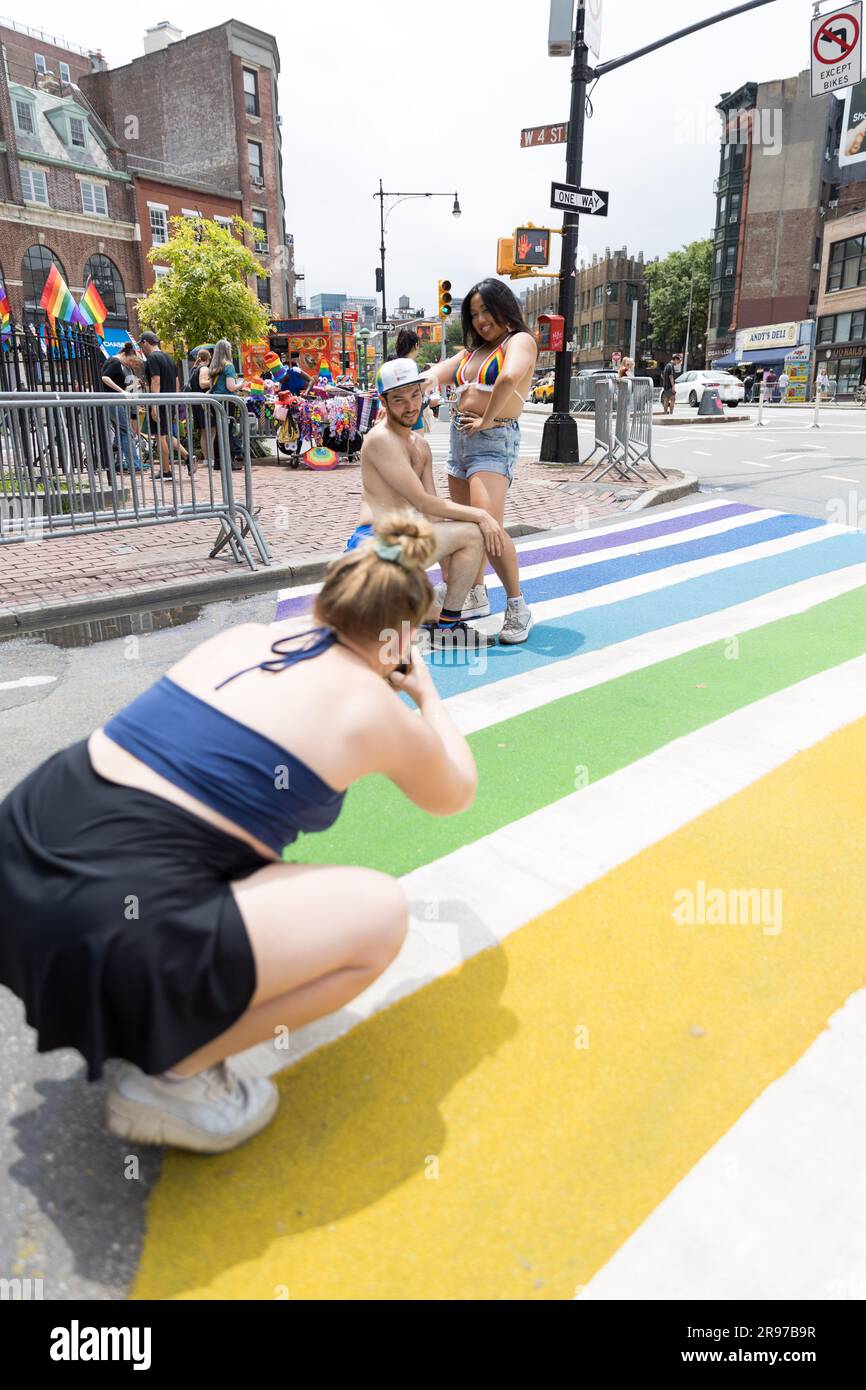 A crosswalk is decorated in rainbow colors in honor of LGBTQIA  pride month in front of the Stonewall bar on Manhattan Island in New York, USA. 06th Apr, 2023. (Photo: Vanessa Carvalho) Credit: Brazil Photo Press/Alamy Live News Stock Photo