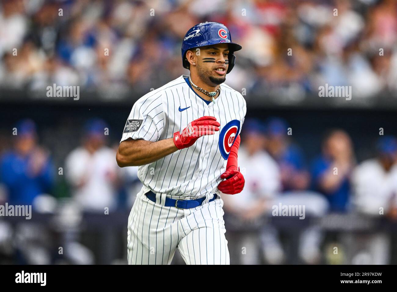 Christopher Morel 5 of the Chicago Cubs runs to first base after