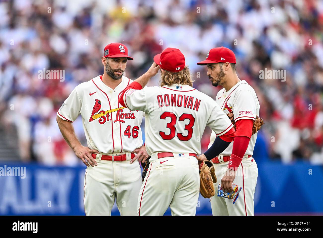 Brendan Donovan #33, Nolan Arenado #28 and Paul Goldschmidt #46 of the St. Louis Cardinals chat during the 2023 MLB London Series match St. Louis Cardinals vs Chicago Cubs at London Stadium, London, United Kingdom, 24th June 2023  (Photo by Craig Thomas/News Images) Stock Photo