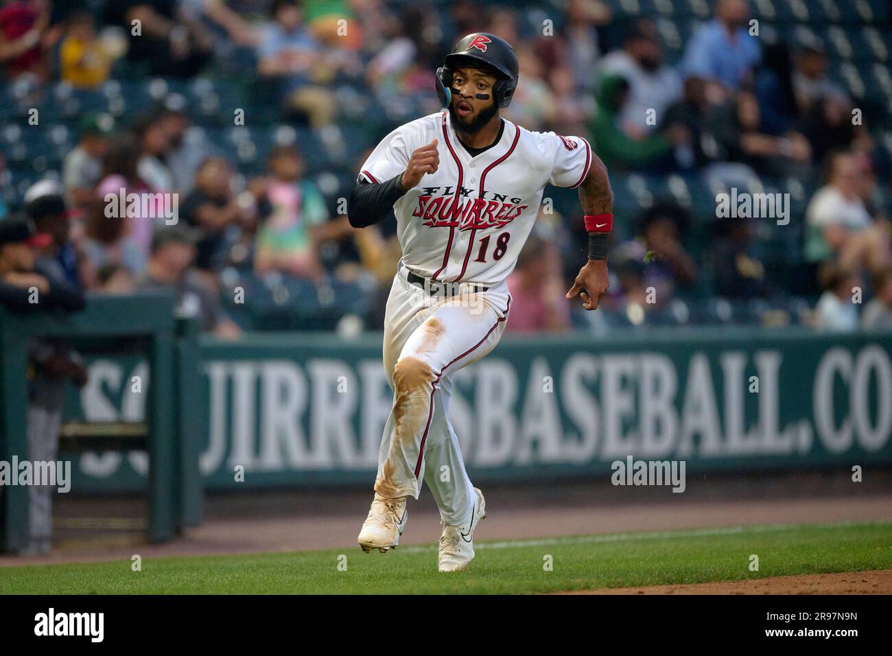 Richmond Flying Squirrels Carter Williams (18) scores a run during an