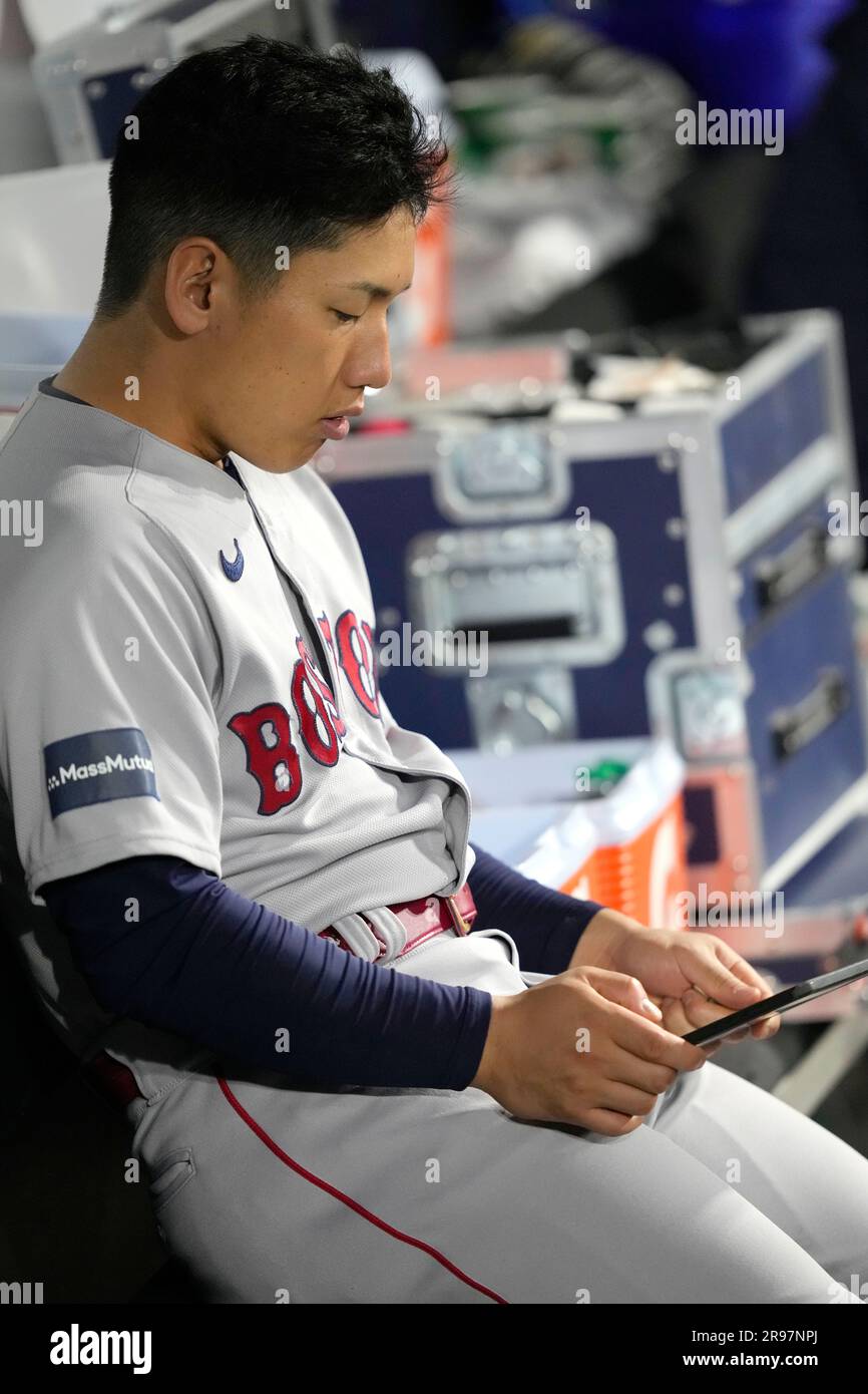 Boston Red Sox's Masataka Yoshida looks at a video during a baseball