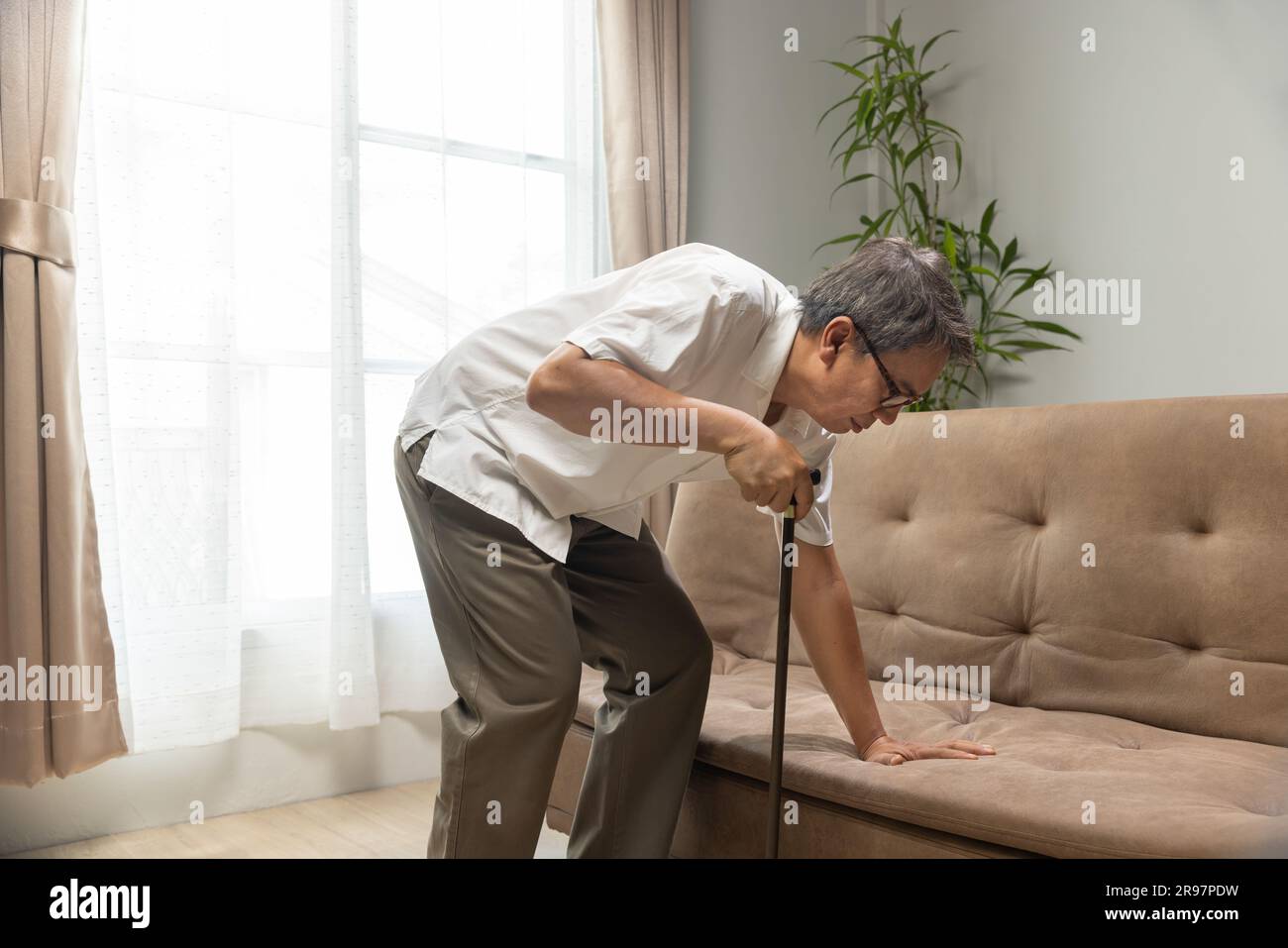 Older man that having Sarcopenia or muscle loss. Sarcopenia is a degenerative disease of the muscle usually caused by the natural consequence of aging Stock Photo