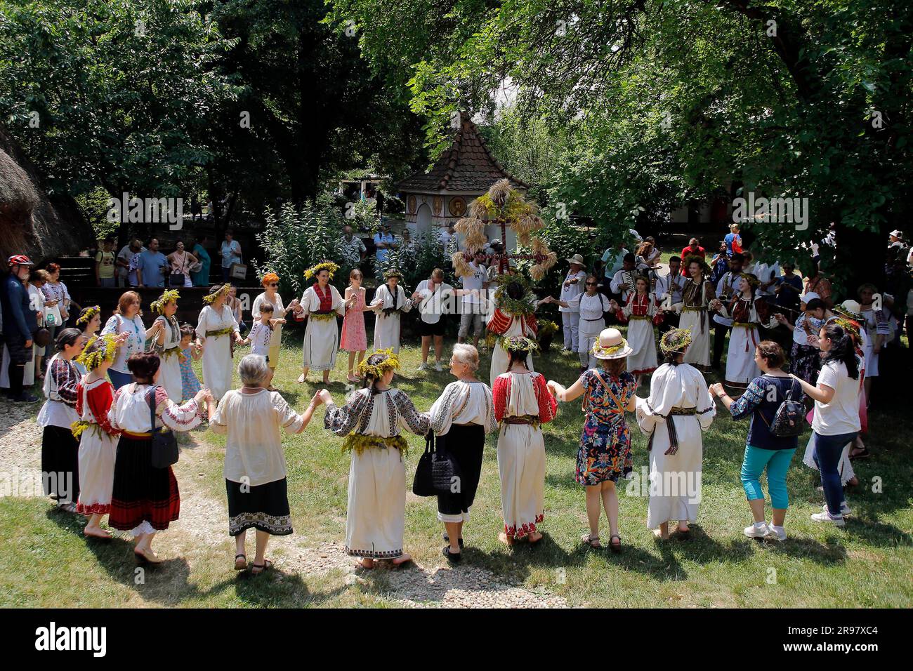 Bucharest, Romania. 24th June, 2023. Visitors dance with young girls