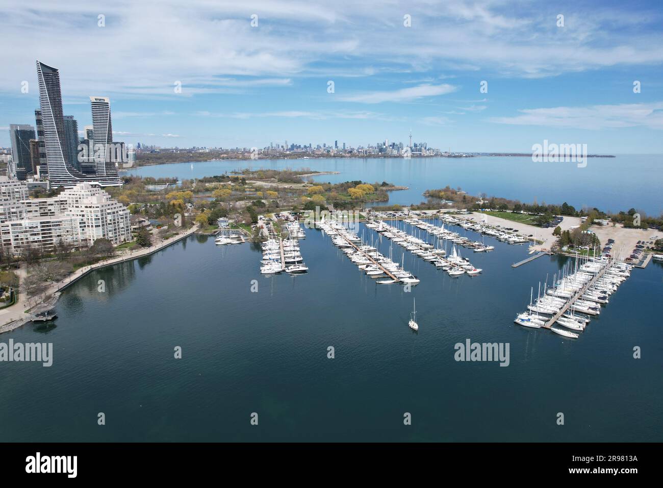 An aerial view of a harbor with boats docked in the bay and the city in ...