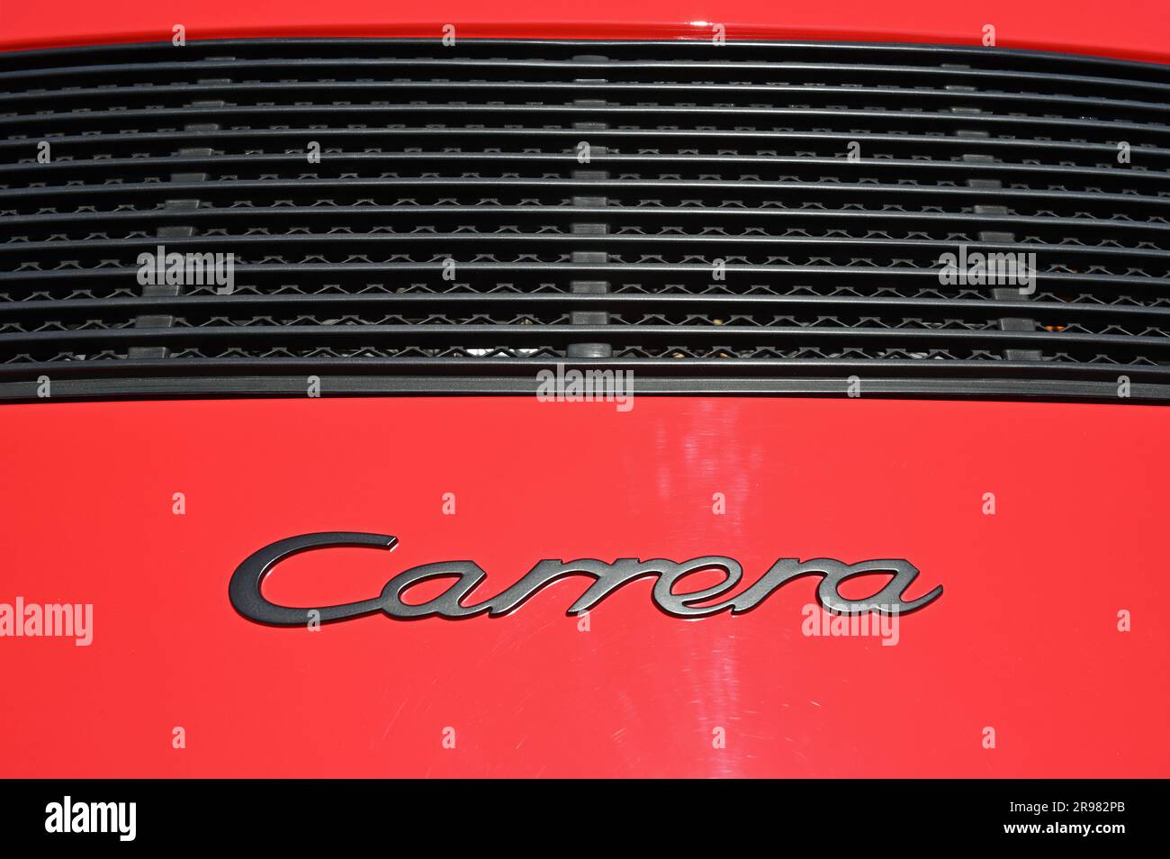 The lettering 'Carrera' on a red car Stock Photo