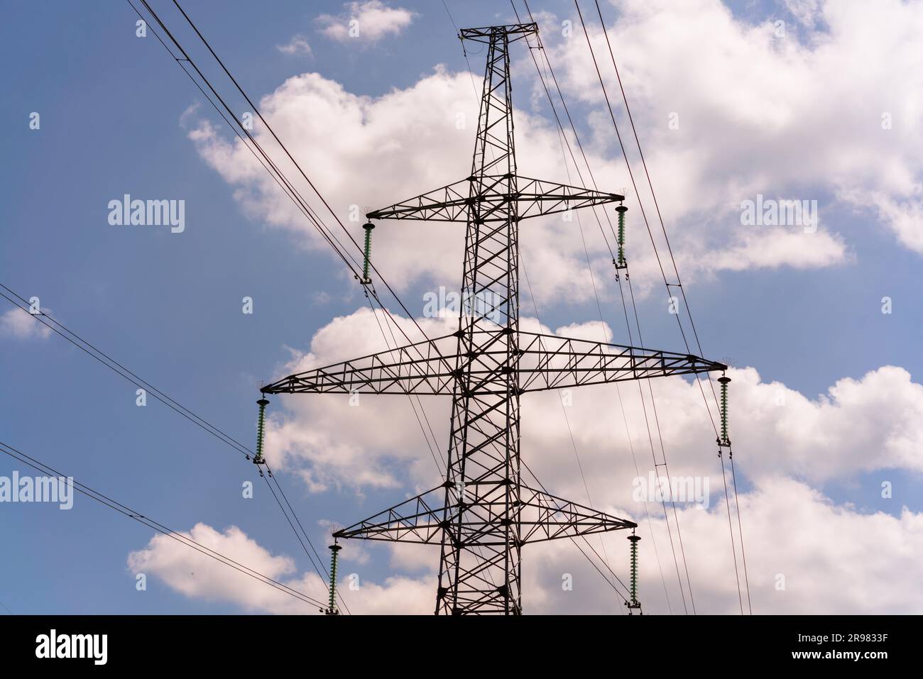 High voltage towers with sky background. Power line support with wires ...