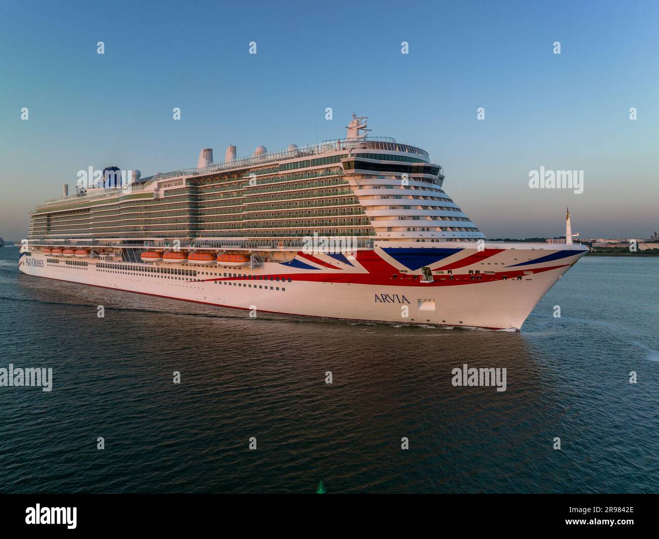 Arvia is an Excellence-class cruise ship in service for P&O Cruises, a subsidiary of Carnival Corporation & plc.  Arriving at Southampton aerial Stock Photo