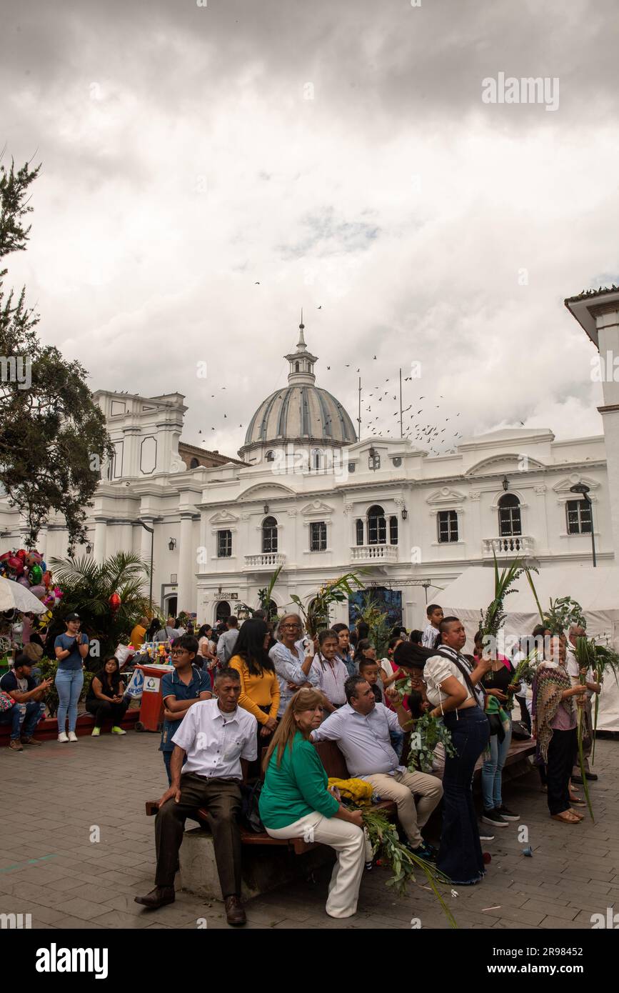 A group of people are seen participating in a religious procession in Popayan, Colombia, on Domingo de Ramos, the first day of Semana Stock Photo